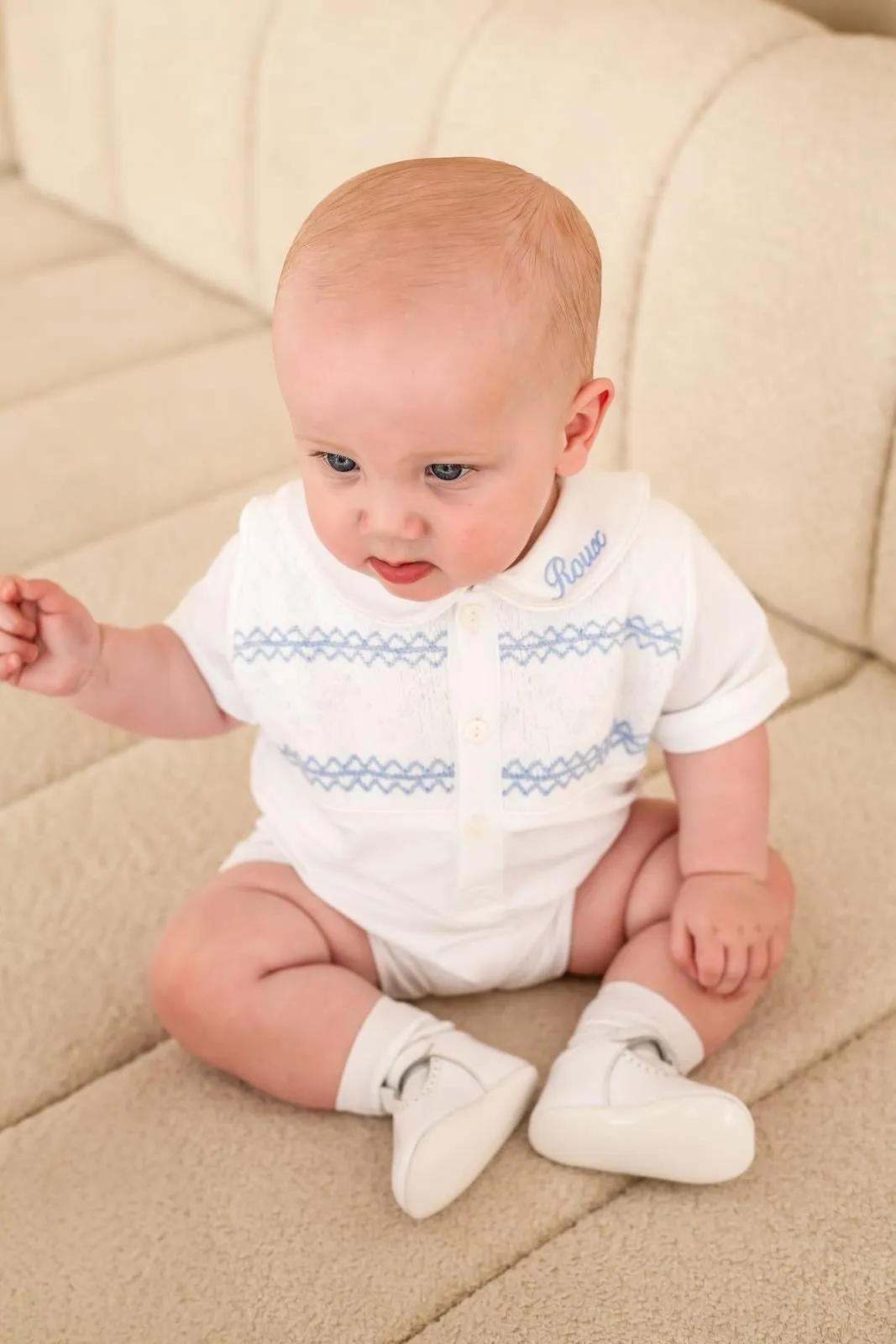 Boys White Smocked Romper Trimmed with Blue