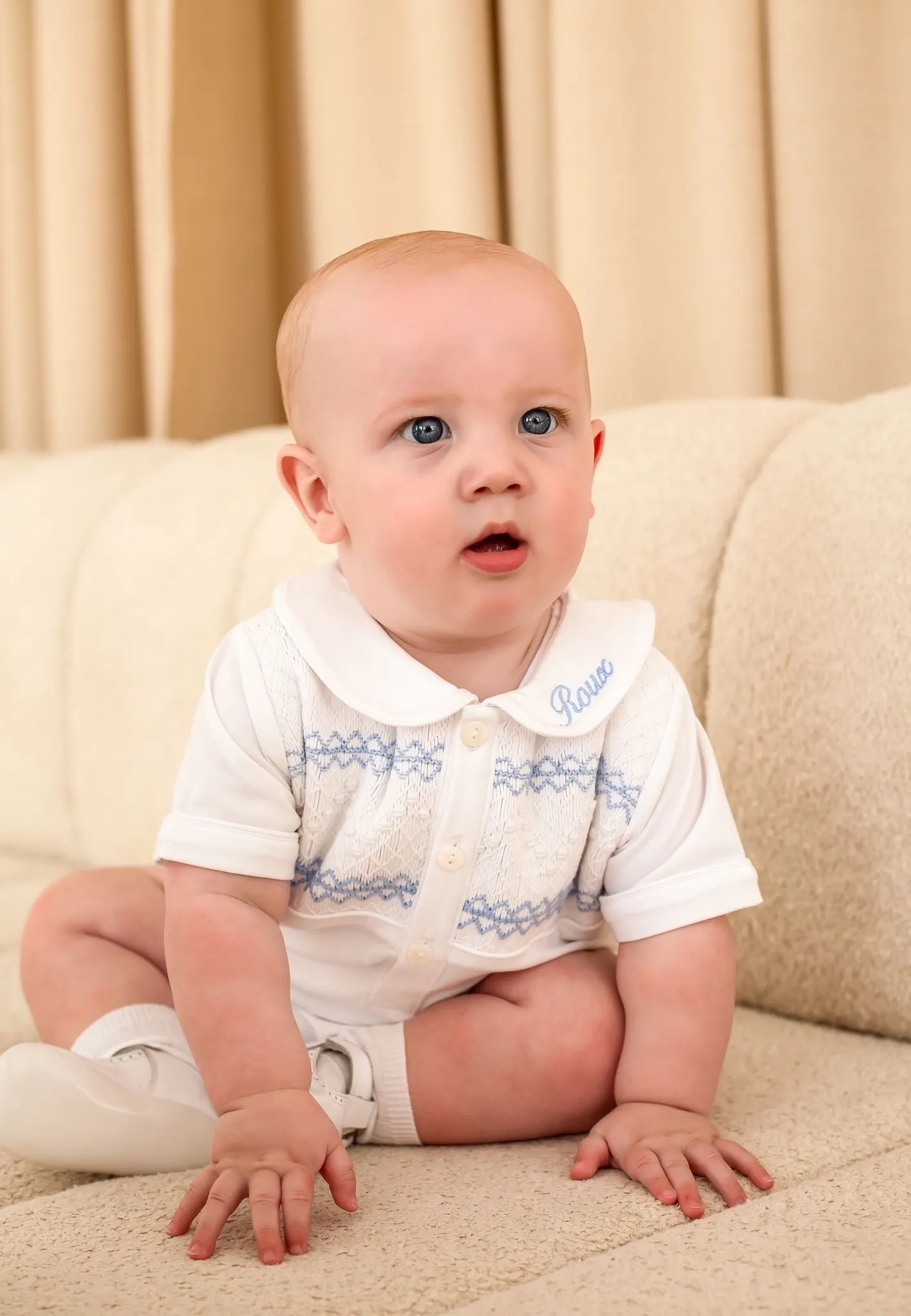 Boys White Smocked Romper Trimmed with Blue