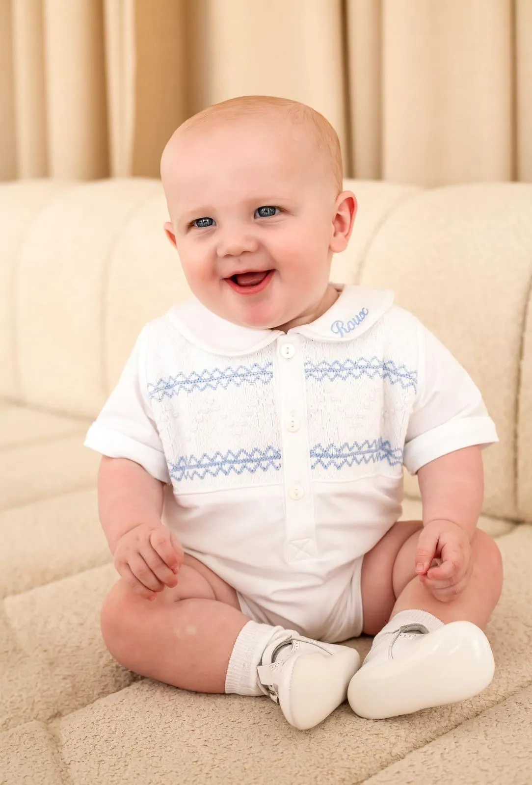 Boys White Smocked Romper Trimmed with Blue